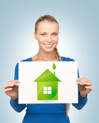 woman with illustration of green eco house