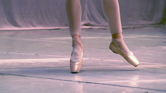 Ballerina shows classic ballet pas. Slow Motion 240 fps.