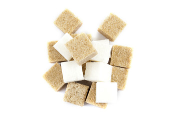 bunch of white and brown lump sugar on a white background