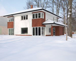 Modern mansion covered with snow