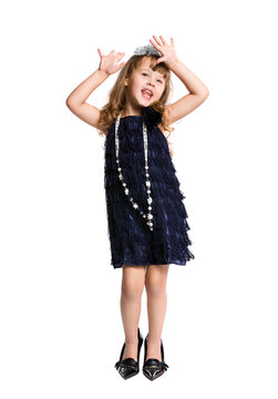 ittle girl in retro dress dancing on a white background