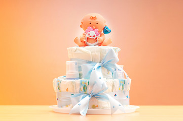 Cakes made of diapers on white