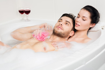 beautiful couple is taking a bath