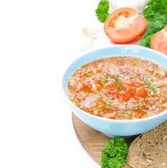 bowl of tomato soup with buckwheat isolated closeup