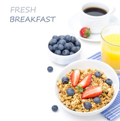 breakfast with homemade granola and fresh berries, orange juice