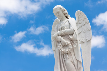 Beautiful angel with a blue sky background