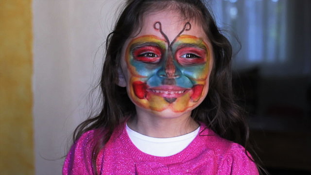 Little girl with mask painted
