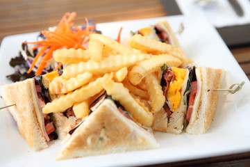 Club sandwich with on wood background