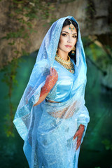 Beautiful indian woman in Sari. Arabian bellydancer