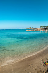 View of empty sandy beach in Cyprus resort, Mediterranean sea