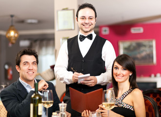 Waiter serving a couple