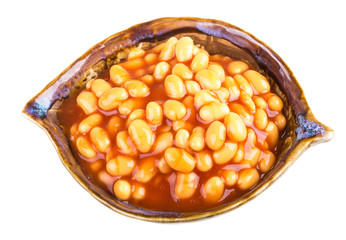 Marinated haricot beans in tomato sauce with shallots on a plate