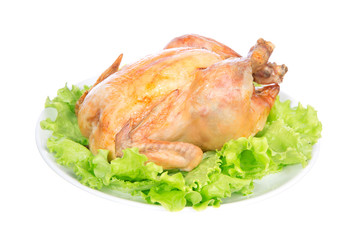 Garnished roasted chicken on a plate
