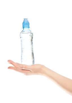 drinking water bottle in woman hands