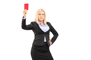 Angry businesswoman holding a red card