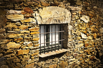 Fototapeta na wymiar stone wall and a window