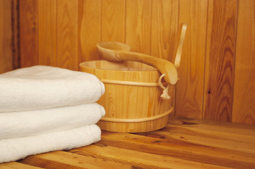 Fototapeta na wymiar Sauna - Łyżka chochla i ręcznik w saunie
