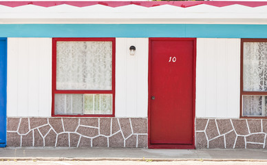 Motel with red and blue doors