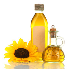 oil in jars and sunflower, isolated on white