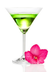glass with cocktail and gladiolus bud isolated on white