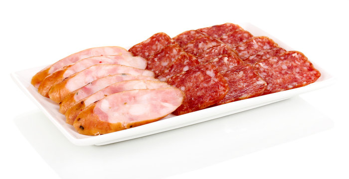 Tasty sliced sausage on plate isolated on white