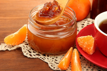 light breakfast with tea and homemade jam, on wooden table