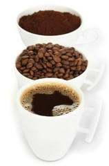 Different types of coffee in three cups isolated on white