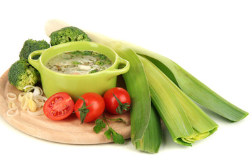 Diet soup with vegetables in pan isolated on white