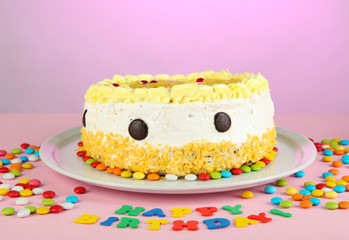 Happy birthday cake, on pink background