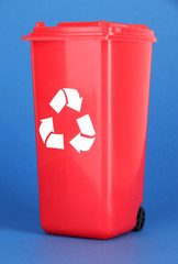Recycling bin on blue background