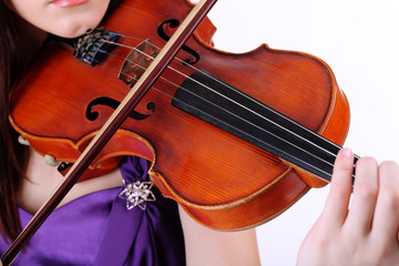 Beautiful young girl with violin, isolated on white