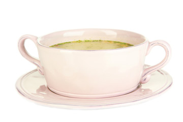 Nourishing soup with vegetables in pan isolated on white