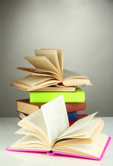 Stack of books on gray background