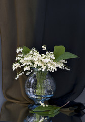 Vase with lily of the valley flowers