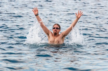 Muscular swimmer in the water