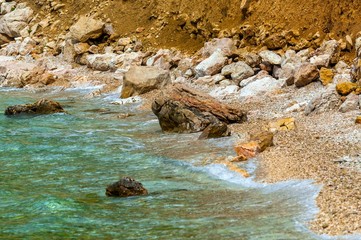 Shore of an ocean with big rocks