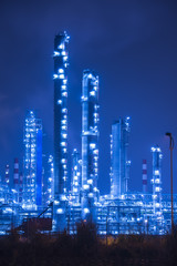 Oil refinery working at night