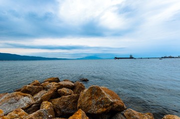 Shore of an ocean with big rocks