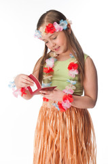 Small and beautiful girl in Hawaiian dress