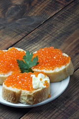 red caviar on slices of baguette
