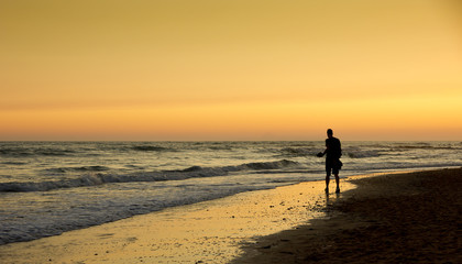Naklejka premium Golden sunset on the beach