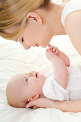happy mother with baby over white