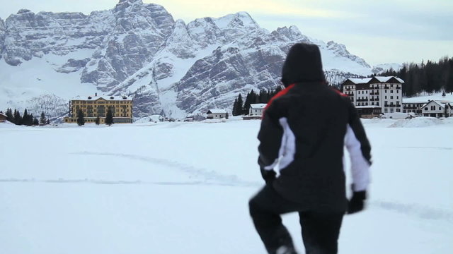 Man walking on deep snow