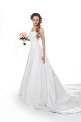 Fototapeta na wymiar Beautiful bride in luxurious wedding dress isolated on white bac