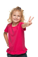 Pretty young girl makes a victory sign