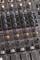 Closeup of audio mixer with filter knobs