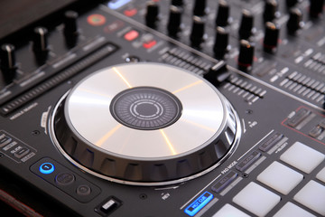Closeup of dj controller with jog wheel © liubomirt