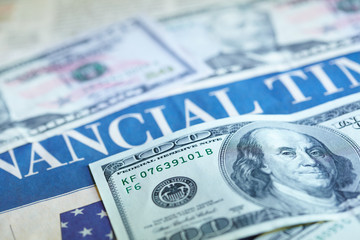 Business newspaper with money