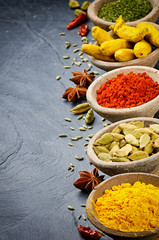 Colorful mix of spices on stone background