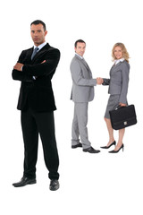 Three businesspeople on a white background